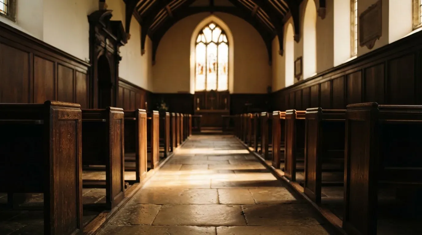 An empty courtroom with wooden benches in morning light